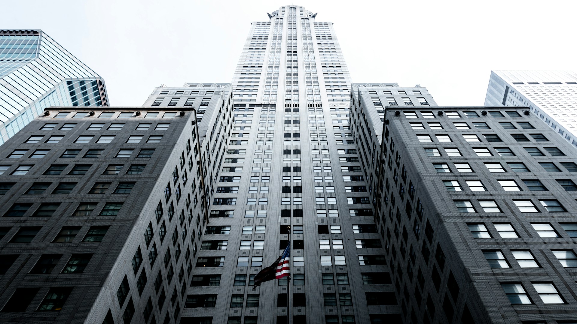 low angle photo of gray concrete high-rise building