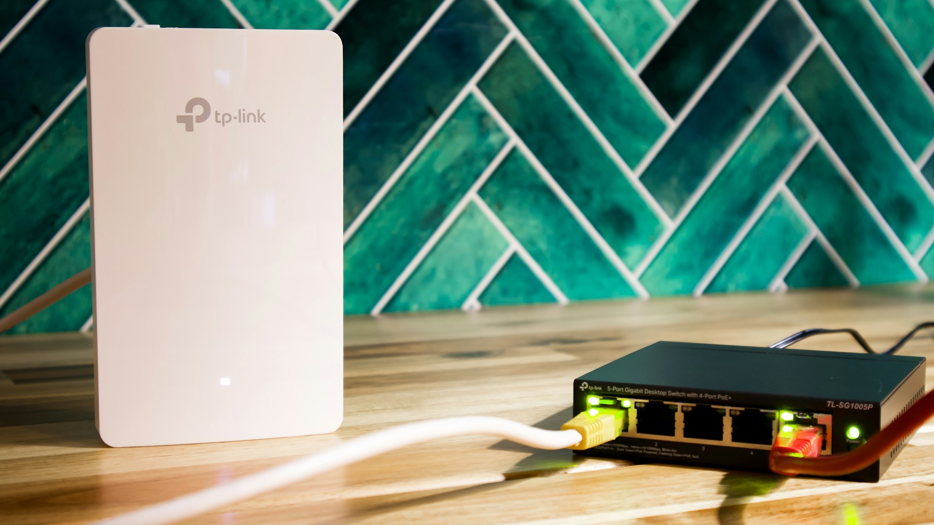 A wi-fi router and a network switch sit side-by-side.