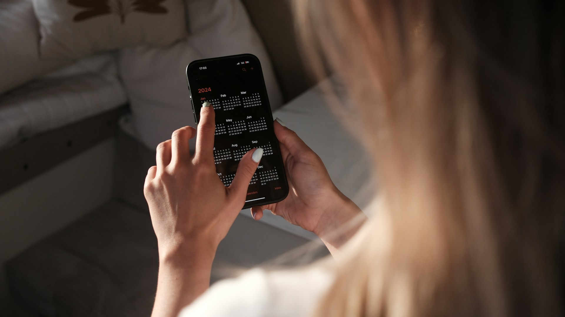 a woman holding a cell phone up to her face
